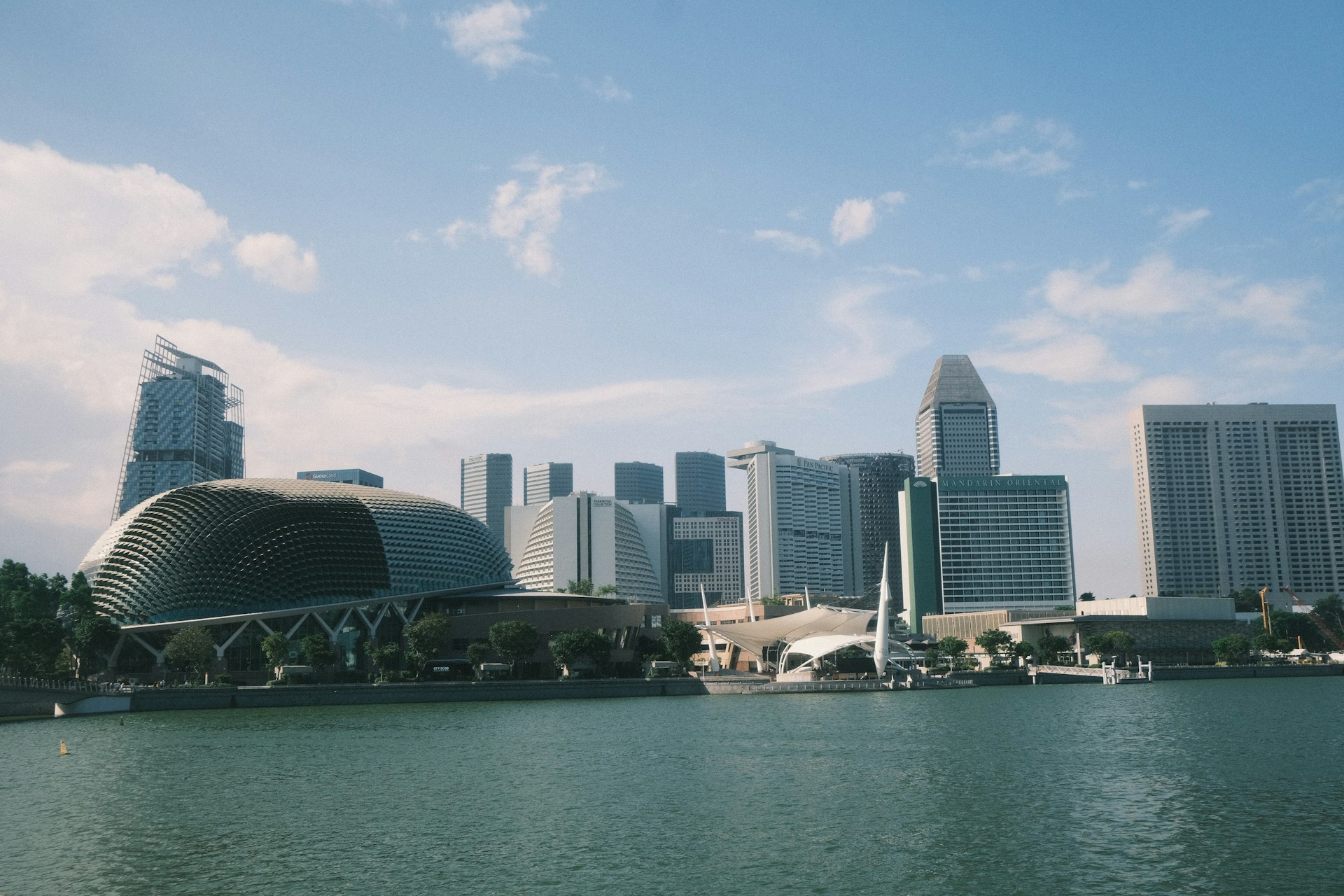 A large body of water with a city in the background